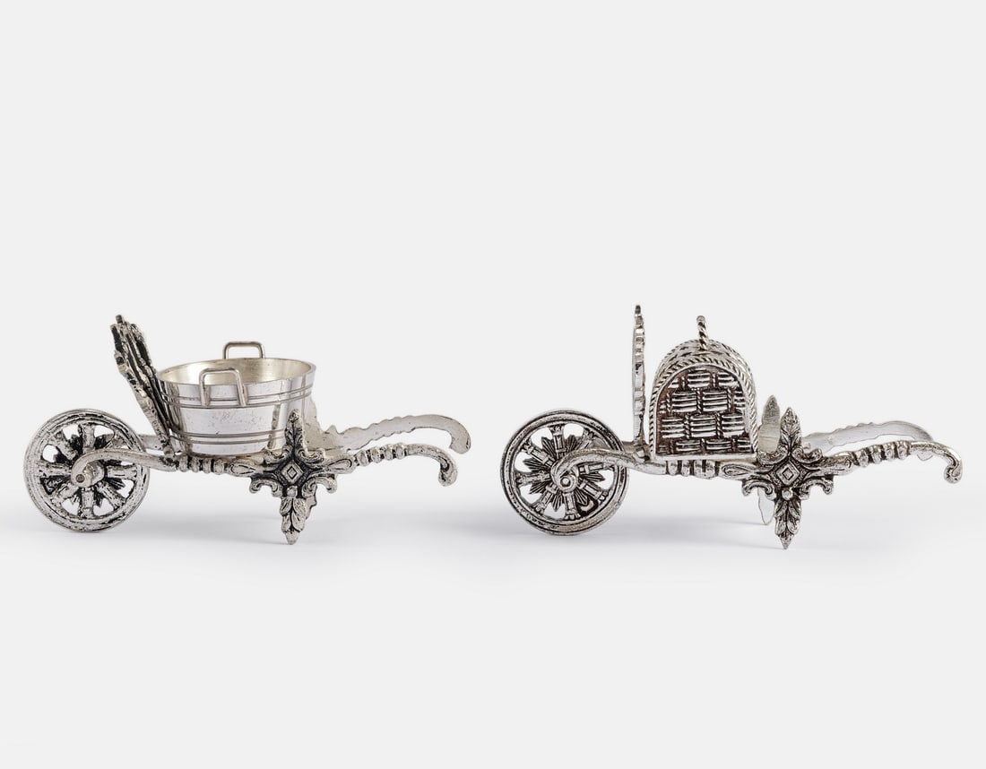 Dutch Silver Miniatures: Lot of 2 Dutch sterling silver miniatures, modeled as wheelbarrows. Length: 8 cm. Total weight: 69 grams. Hallmarked.