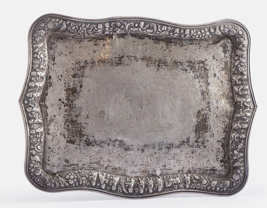 Persian Silver Tray: Persian silver tray, Shiraz work. Embossed and engraved with figures, animals, and floral motifs. Dimensions: 29X38 cm. Weight: 735 grams. Unsigned, silver tested. Flaws.