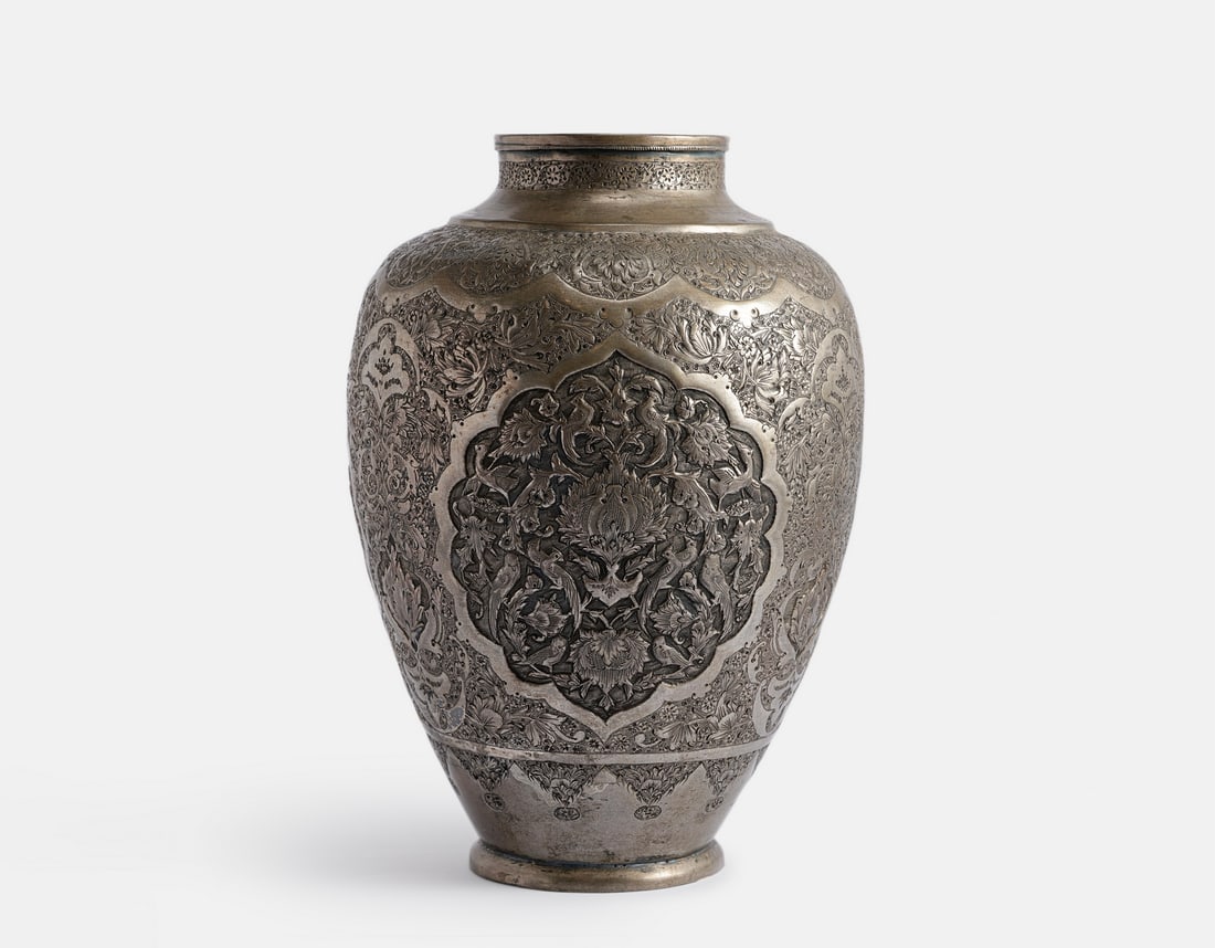 Persian Silver Ewer: Persian silver ewer. Embossed and engraved animals and floral motifs. Height: 23.5 cm. Weight: 706 grams. Hallmarked, silver tested.