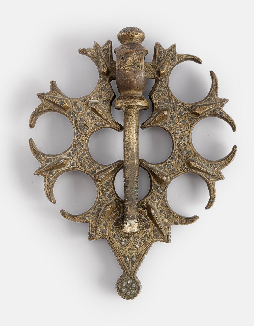 Bronze Door Knocker, Safavid Dynasty: Bronze door knocker, Persia, Safavid dynasty, 17th century. Inlaid with silver and decorated with floral motifs. Length: 28 cm.