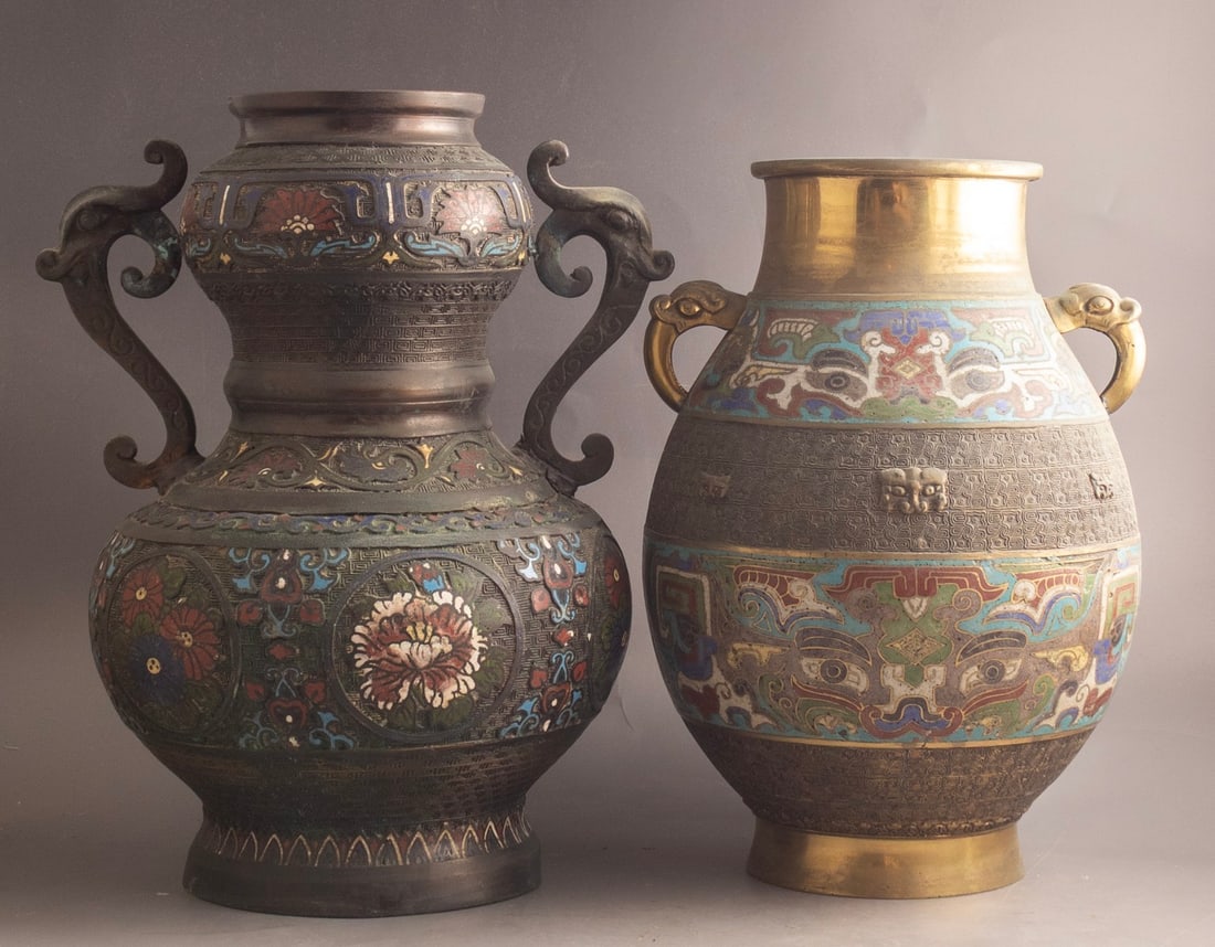 Champleve & Cloisonne Bronze Vases: Lot of 2 Asian bronze vases, China and Japan. Decorated with Cloisonne & champlevé enamel. Height: 33.5-36 cm. One is marked. Flaw to one of the handles.