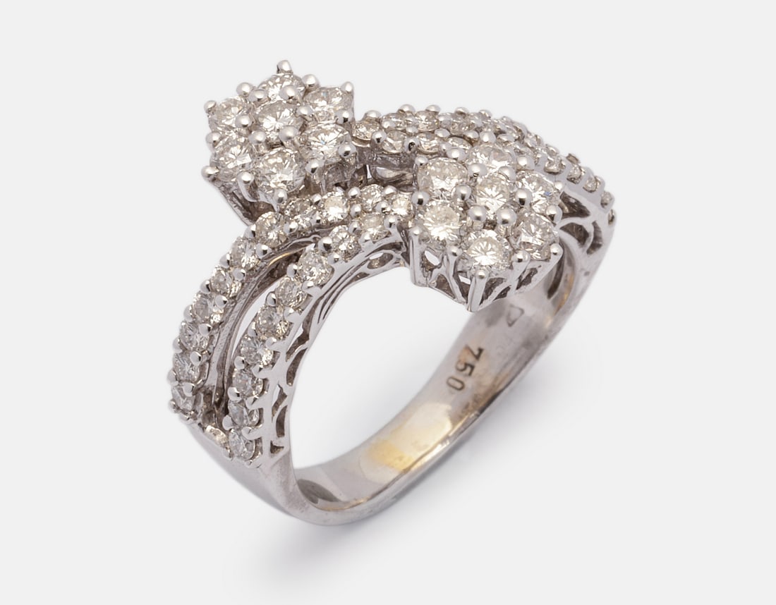 Gold Diamond Ring: 18K white gold ring set with 14 diamonds weighing about 3 points and about 40 diamonds weighing about 1 point each, for a total of about 82 diamond points. Size: 3.5 US, Weight: 4.1 g. Hallmarked.