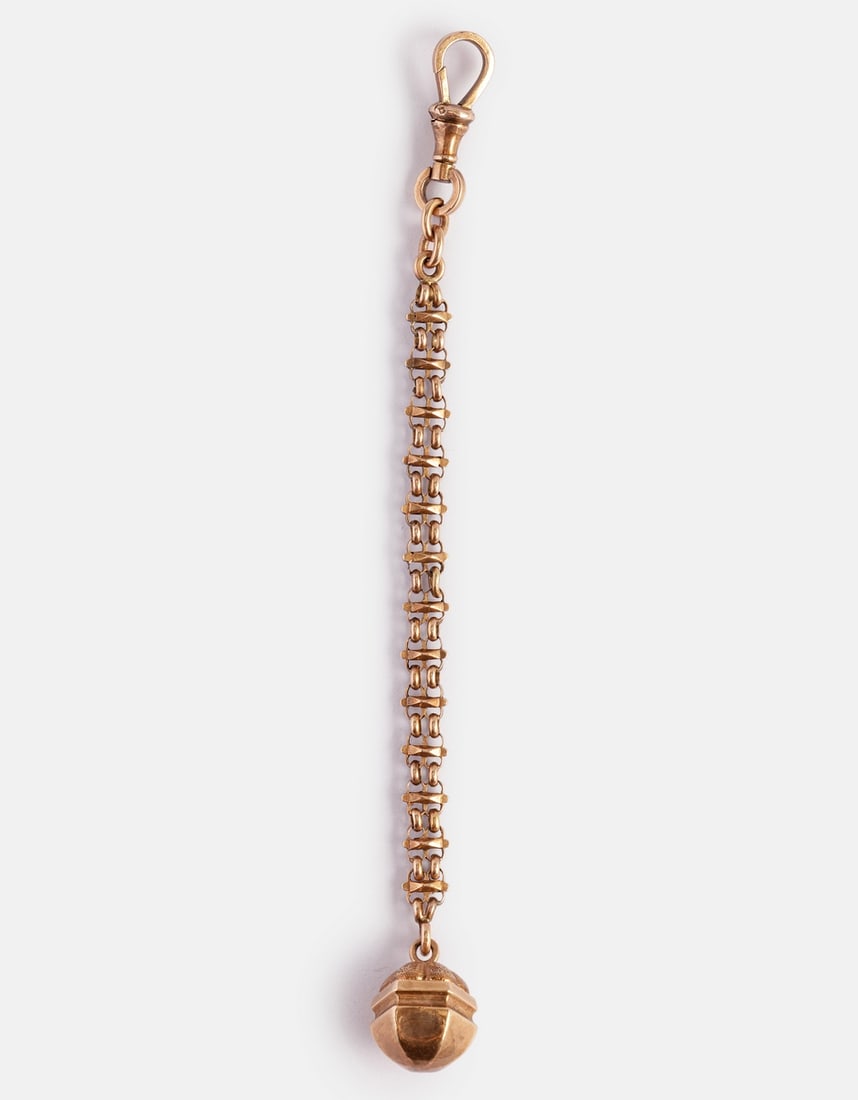 Gold Chatelaine: 12K gold Chatelaine. Length: 11.5 cm. Weight: 4.7 g. Unmarked, the gold has been tested.