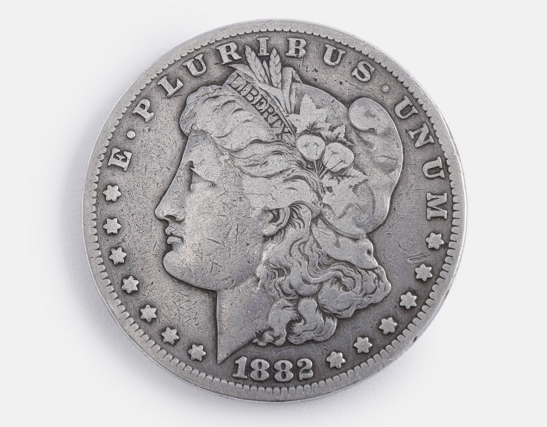 Silver Morgan Dollar Coin, CC: Silver Morgan Dollar coin, Carson City (CC) Mint. Weight: 26.15 grams. F–VF.