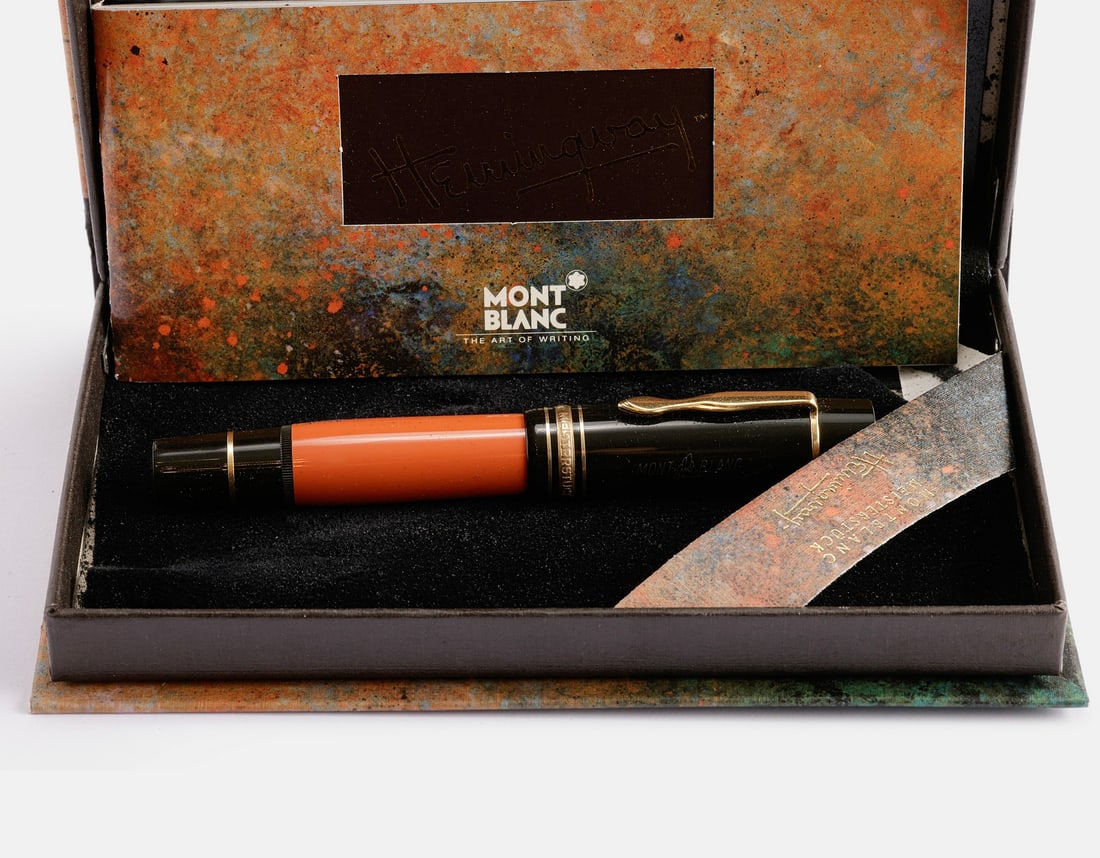 Montblanc Ernest Hemingway Ltd Edition Fountain Pen: Montblanc Fountain pen, Ernest Hemingway, Limited Writers Edition, 1992. Orange & Black. Size: 5.2" (13.2 cm). 18K gold nib, F. Excellent condition, with original box (wear to inner sponge).