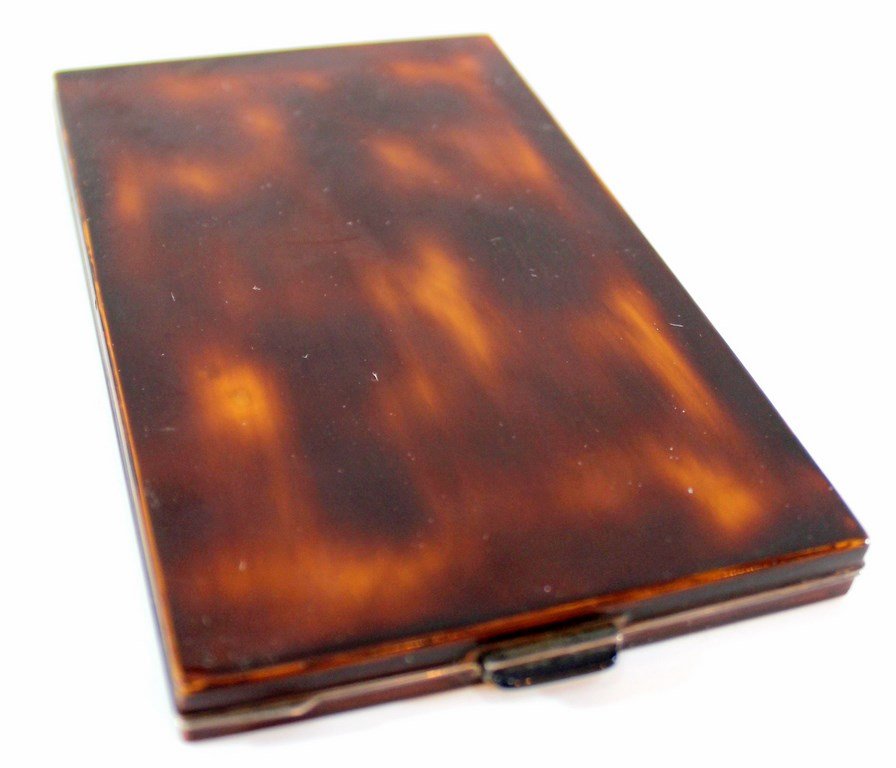 Vintage tortoise shell cigarette case: A vintage silver cigarette case covered with tortoise shell. Dimensions: 13.5x8 cm. Engraved in the interior part: ECS. Signed. Weight: 232 grams. Very minor flaws.