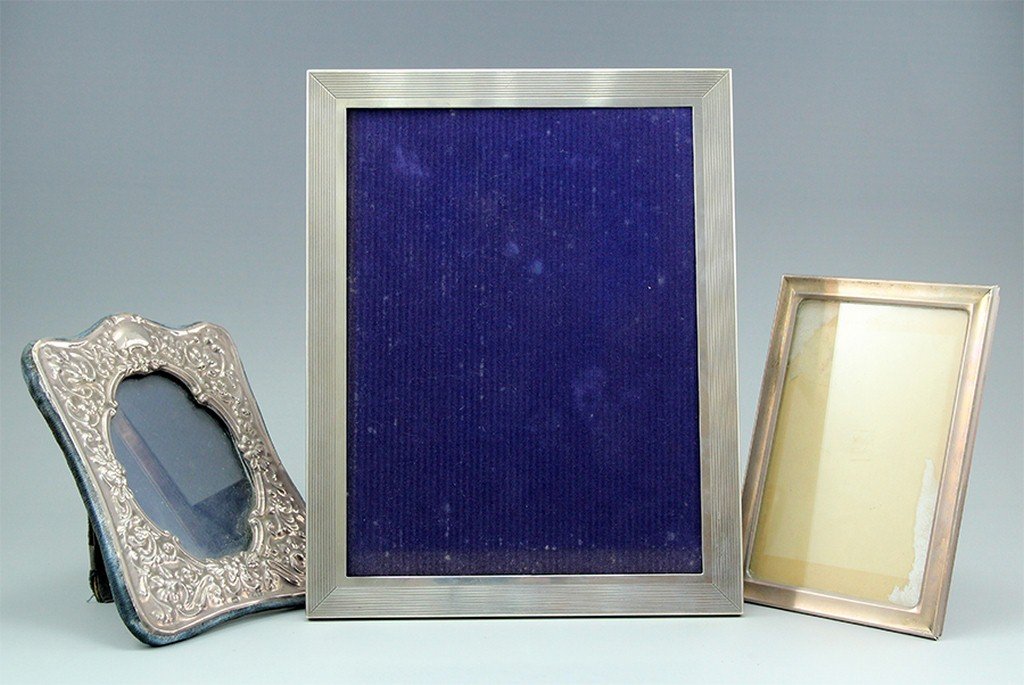 Lot of three sterling silver picture frames: Lot of three sterling silver picture frames including an Italian frame (28x22 cm), an English frame (18x13.5 cm) and an additional frame (17.5x12.5 cm). Signed.