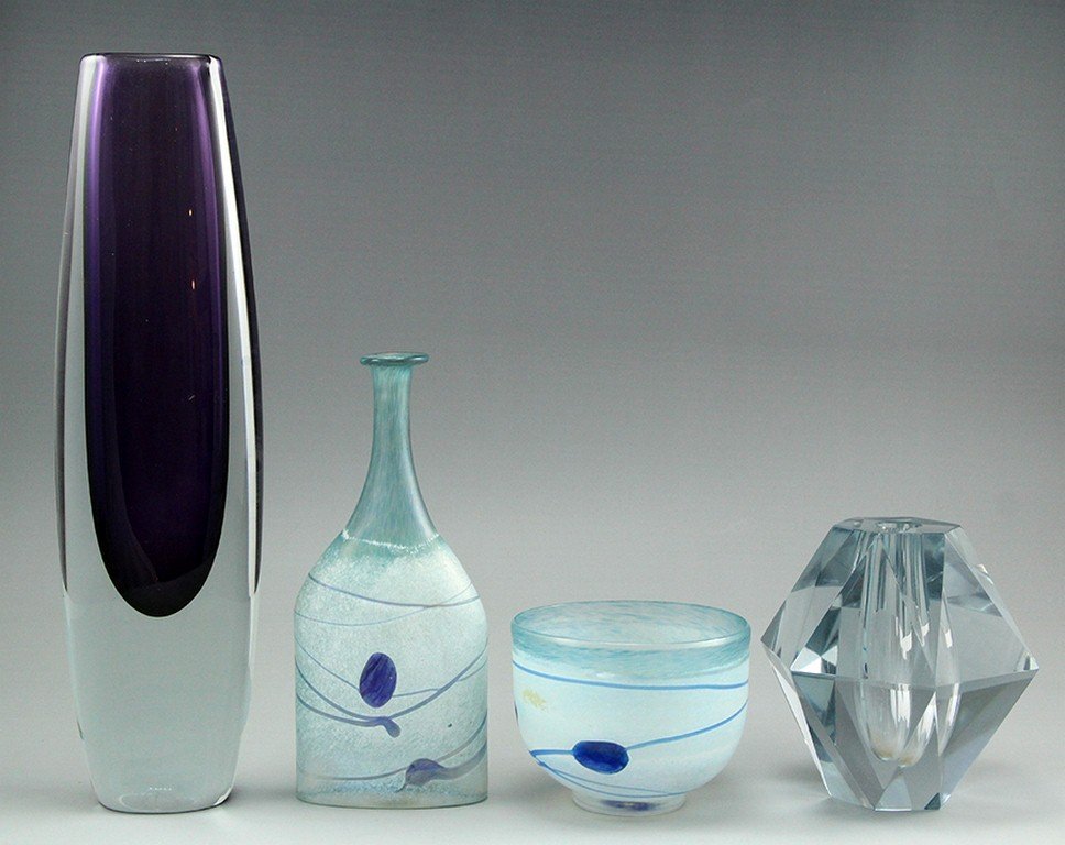 Lot of four Scandinavian glass items: Lot of four Scandinavian glass items including two items by Kosta Boda, designed by Bertil Vallien, a vase by Lundberg (height: 34 cm) and an additional vase (height: 14 cm). Signed.