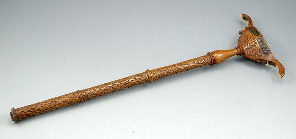 Islamic wooden Scepter: An Islamic wooden Scepter carved with floral motifs. With various Arabic inscriptions. Length: 51 cm. Broken.