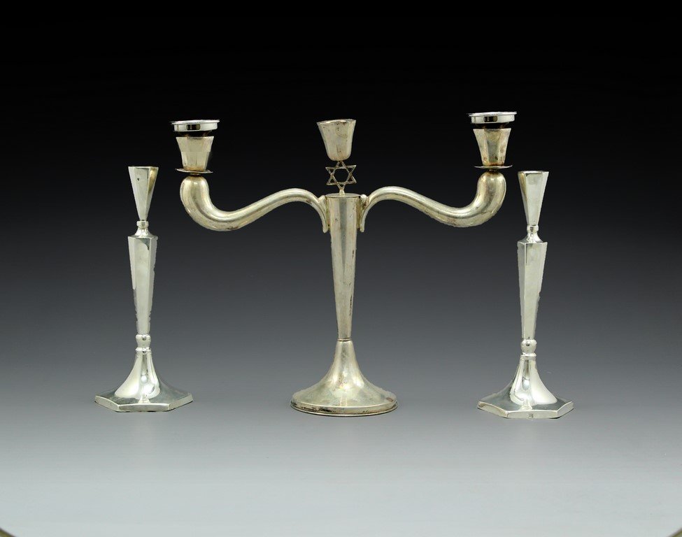 Lot of two Sterling Silver Items: Lot of two sterling silver items including a pair of candlesticks and a 3 branched candelabra. Height of candelabra: 26 cm. Total weight: 474 grams. Hallmarked.