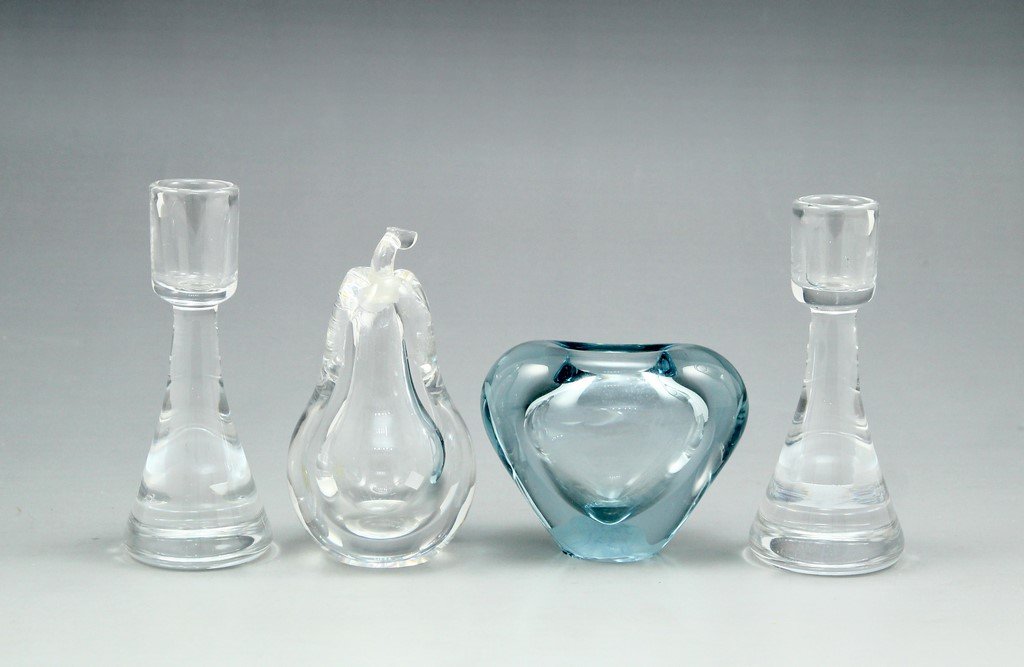 Lot of Scandinavian Glass Items: Lot of Scandinavian glass items comprising of: a pair of Orrefors candlesticks, a Kosta pear-shaped perfume bottle, and a Holmegaard vase. Varying sizes, height: 8-13 cm. Marked.