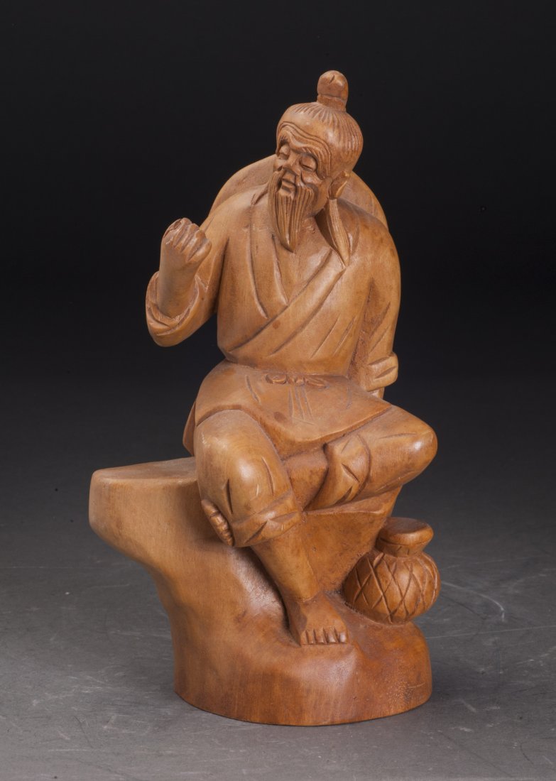 Wood Fisherman Scupture: A fine wood sculpture, nicely shaped as a seating fisherman.