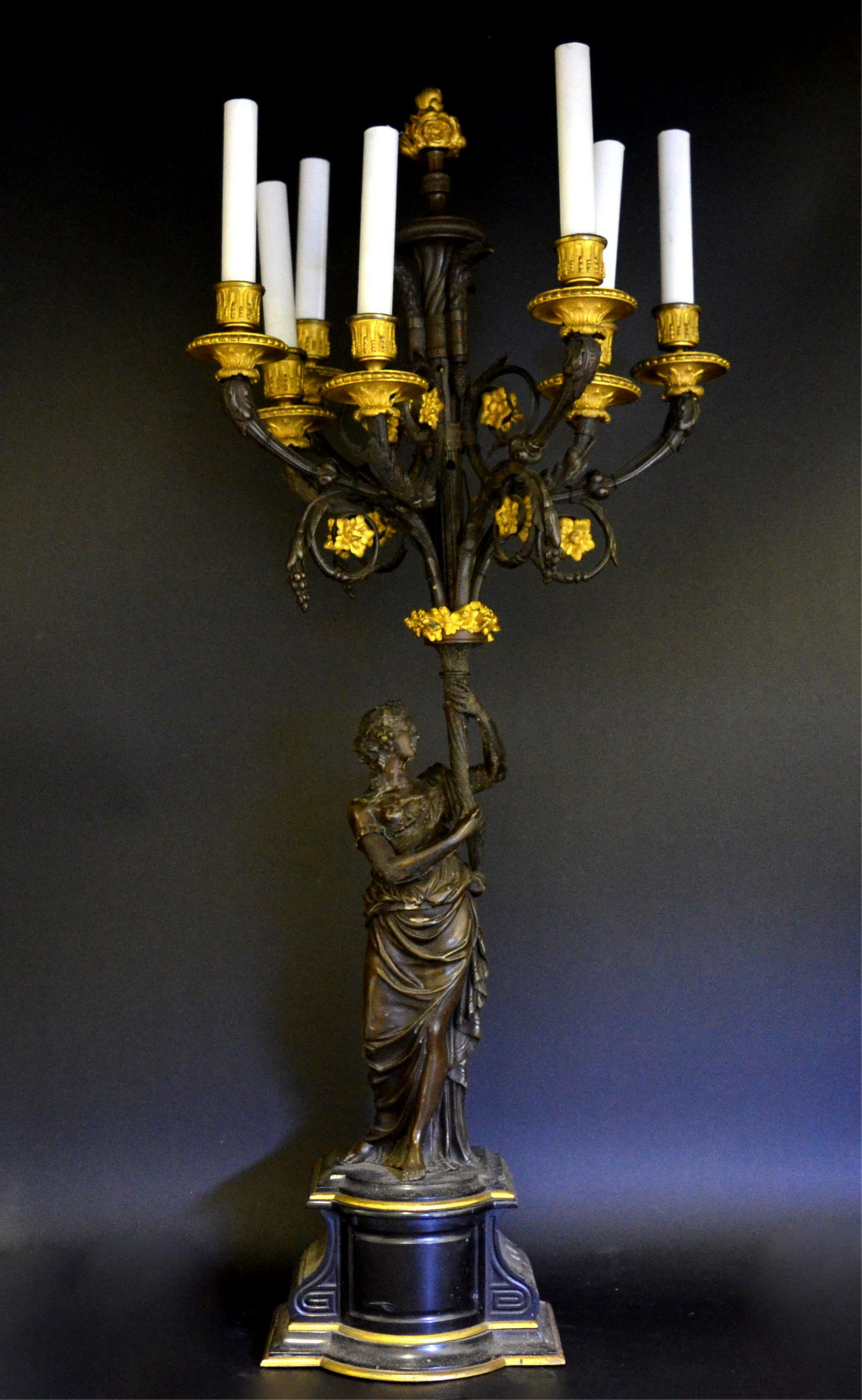 A Patinated Bronze Classical Figural Candelabra: A Patinated Bronze Classical Figural Candelabra. French, 19th century. 36" high