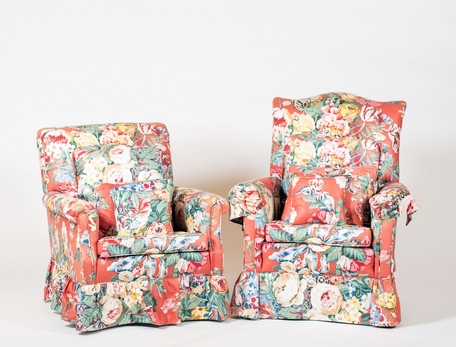 Two Nicely Upholstered Armchairs: Two Nicely Upholstered Armchairs, Top quality backed fabric, down cushions and eight matching pillows of various size, the chairs are mid 20thC and do not match, some fading and wear to arm top but on