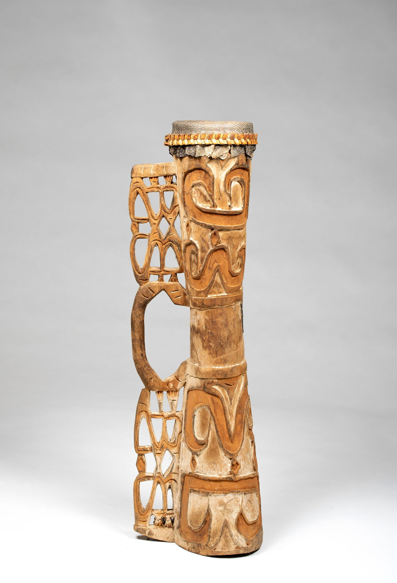 Asmat Drum with Intricate Carved Handle: Exhibited: Traditional Artifacts From the South Pacific, University Gallery, University of Massachusetts at Amherst, Nov-Dec 1991.Asmat Drum with Intricate Carved Handle, Asmat People, Irian Jaya, Ind