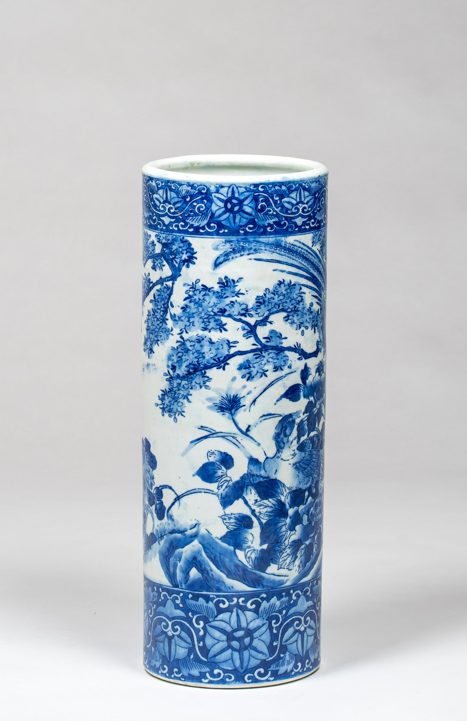 Chinese Blue and White 19thC Umbrella Stand: Chinese Blue and White 19thC Umbrella Stand, 24" tall x 8 1/2" deep blue bird and floral design cylinder from umbrella stand, a circular scene with floral band at the top and bottom, no reign marks bu