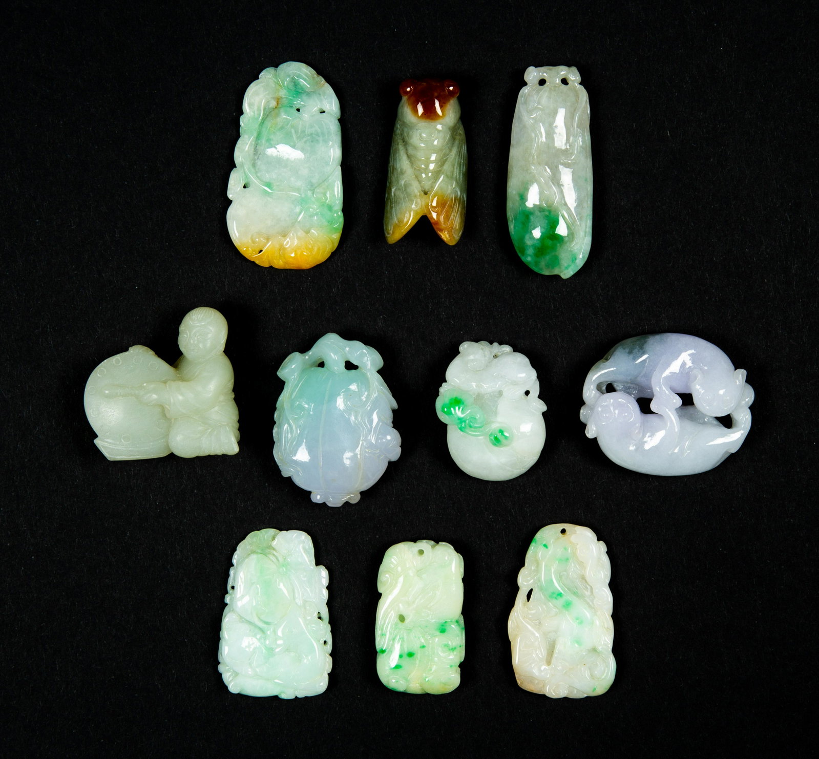 Ten Miscellaneous Jadeite Chinese Carvings, E20thC: Ten Miscellaneous Jadeite Chinese Carvings, E20thC, Ranging in size from 1-2" long, various colors from lavender, pale yellow green to off white, various forms, crickets, fruit, two chilong, boy with 