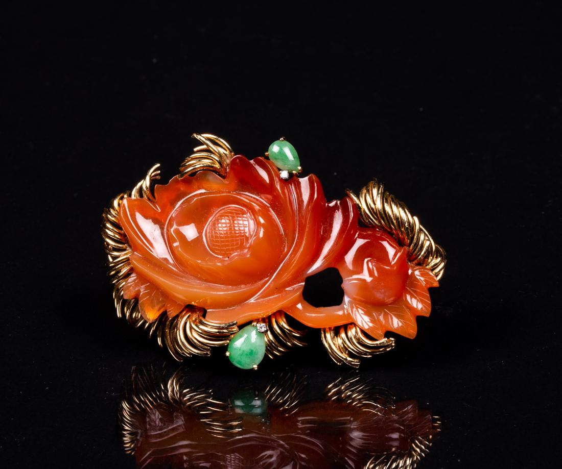 Carved Agate Lotus Brooch: Carved Agate Lotus Brooch, With diamond and jadeite accents, unmarked yellow gold, approximately 2 3/4" widest and 30.4 grams. Estimate: $400 - $600
