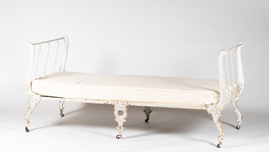 19thC French Casting Iron Folding Day Bed: 19thC French Casting Iron Folding Day Bed, Lyre form arm support ends supported by scrolled cast iron legs ending in castors, the ends fold to the center for storage, old white painted surface, 73" lo