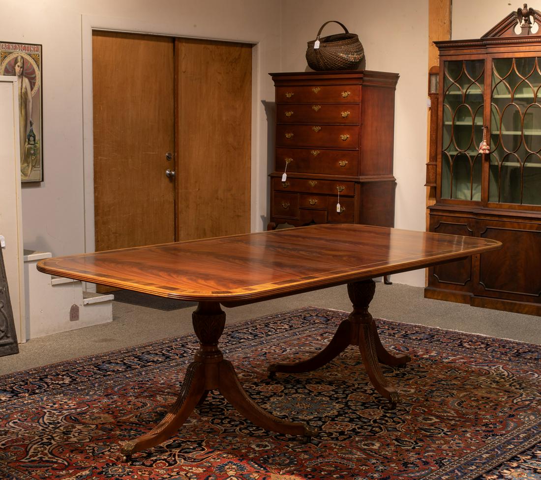 "L&JG Stickley" Banded Double Pedestal Banquet Table: "L&JG Stickley" Banded Double Pedestal Banquet Table, Having a rounded corner top with "D" ends set on a turned mahogany shaft with three outward sweeping leaf carved legs with brass toe castors, come