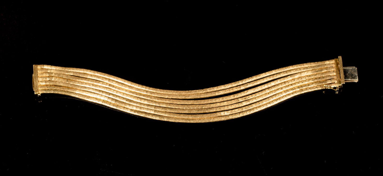 18K Multi-Strand Gold Bracelet: 18K Multi-Strand Gold Bracelet, Marked "750, AR" on clasp with seven strands of matte finish flexible link chain. Clasp has a safety latch and works properly but could be tightened. Approximately 7 3/