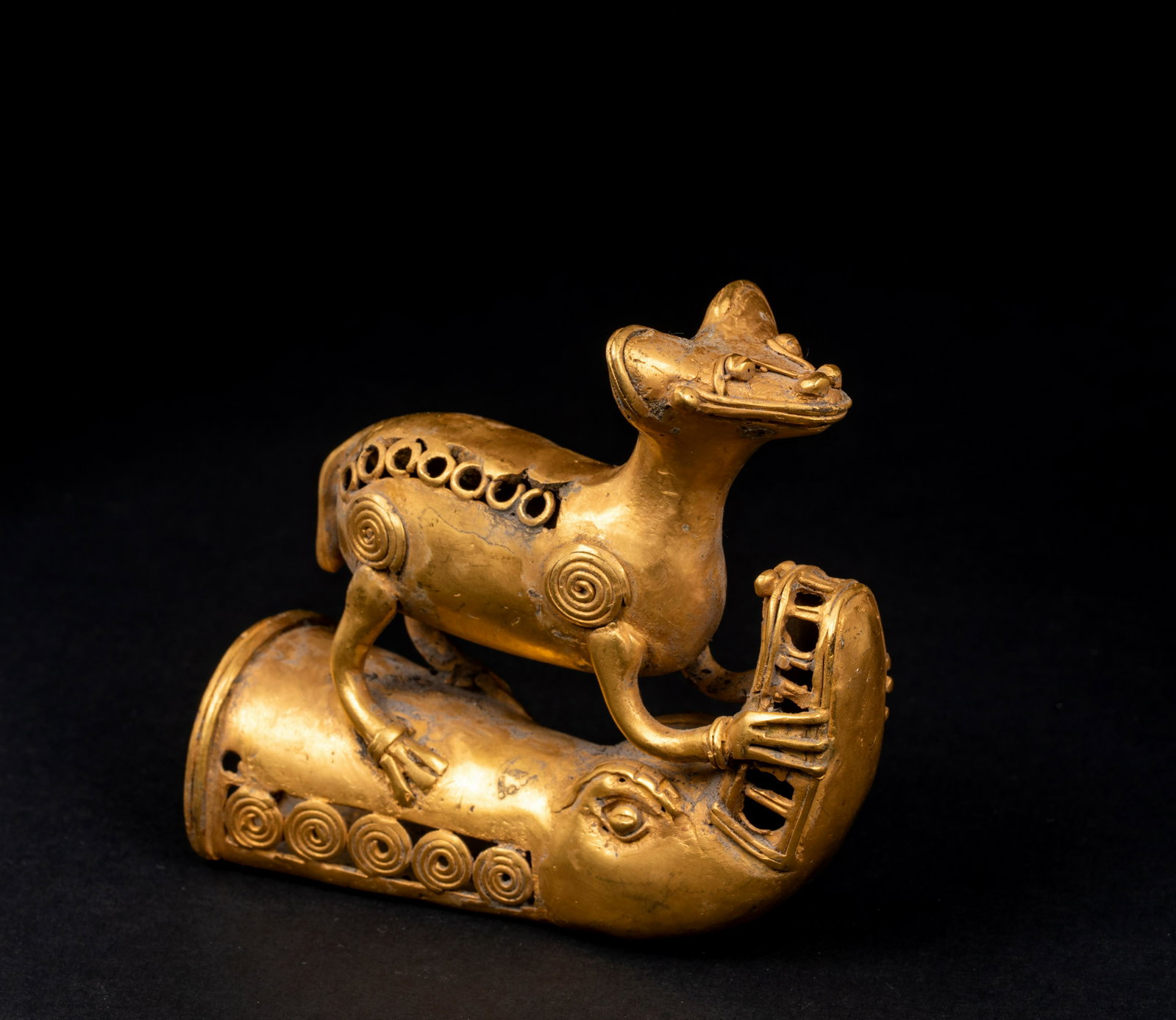 Pre-Columbian "Tairona" Gold Animal Figure: Pre-Columbian "Tairona" Gold Animal Figure, Depicting a four leg cat form figure holding the snout of an alligator, 3 1/8" wide x 2 3/4" tall, approx. 2.6 troy oz. Provenance: NH and Central American 