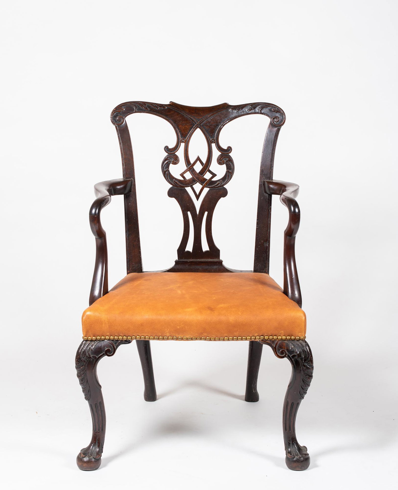 18thC English/Irish Mahogany Chippendale Armchair: 18thC English/Irish Mahogany Chippendale Armchair, Having a leaf carved shaped crest over a carved and pierced splat, shaped open arms, over upholstered seat supported by front leaf carved cabriole le