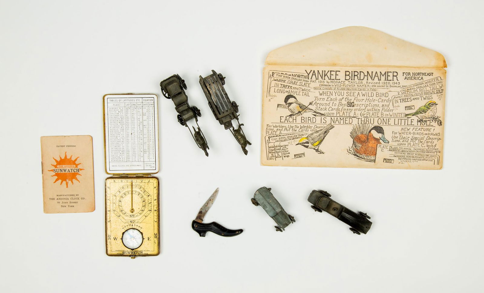 Lot of Miscellaneous Items: Lot of Miscellaneous Items, Sun watch and compass and sundial with original booklet; guta purcha shoe pocket knife; four miniature iron toys, some missing wheels and horses with broken legs; Yankee Bi