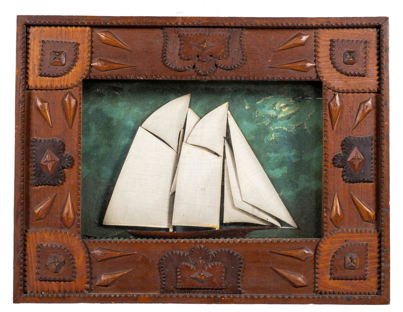 Tramp Art Sailboat Shadow Frame: Tramp Art Sailboat Shadow Frame, Wide folk frame encase a shadow box with a two masted sailing ship with white wooden sails on a green painted background, 19th/20thC, American, 22 3/4" long x 17 1/2"