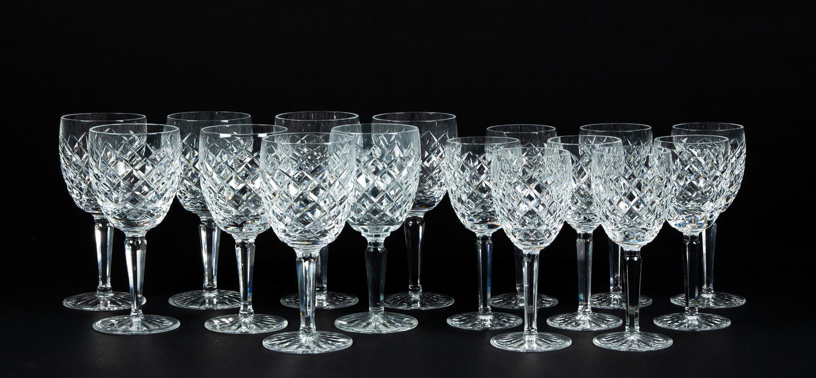 Sixteen Waterford Glass Waters and Wines: Sixteen Waterford Glass Waters and Wines, Eight 7" tall water goblets and eight 6 1/2" tall wine glasses, etched signed under base, "Waterford", good condition.