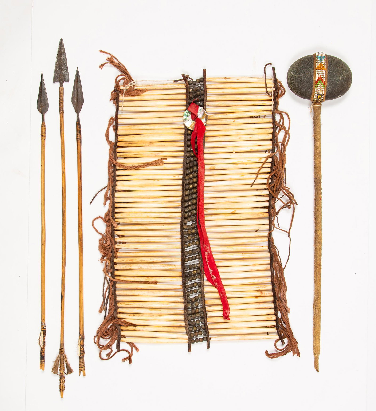 Native American Breastplate and Four Weapons: Native American Breastplate and Four Weapons, Breastplate made from rows of strung bone with leather edging and center panel of leather and metal round beads, strung with brown cotton cord, an abalone