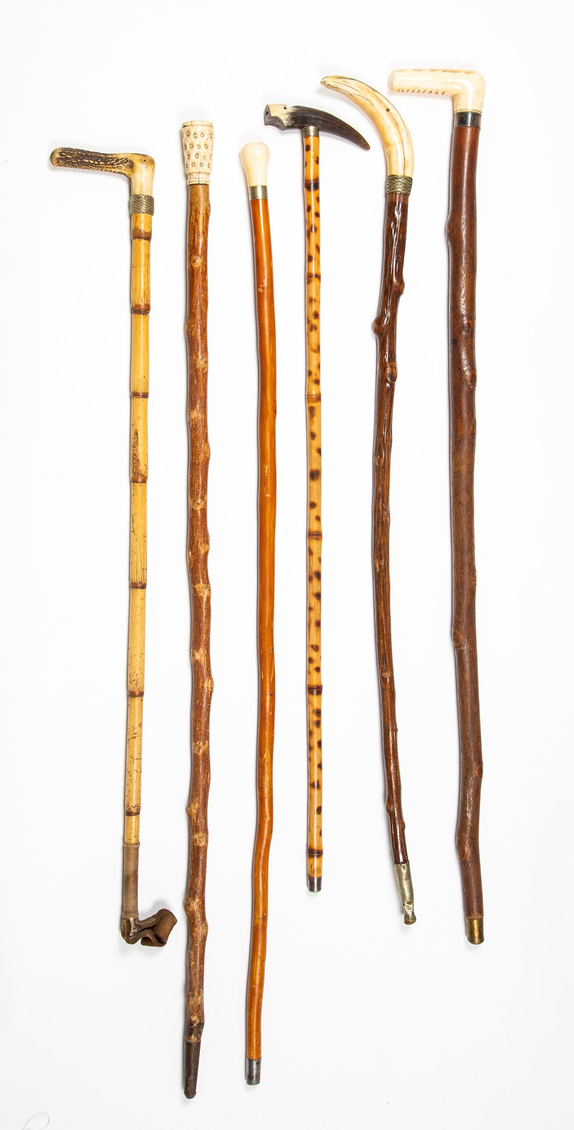 Lot of Six Bone Headed Canes/ Crops: Lot of Six Bone Headed Canes/ Crops, A) "L" shaped bone top cane, 34" long. B) Knob top with inscribed silver collar. C) "L" shaped horn top 30" long riding crop, leather end. D) Carved bone top with 