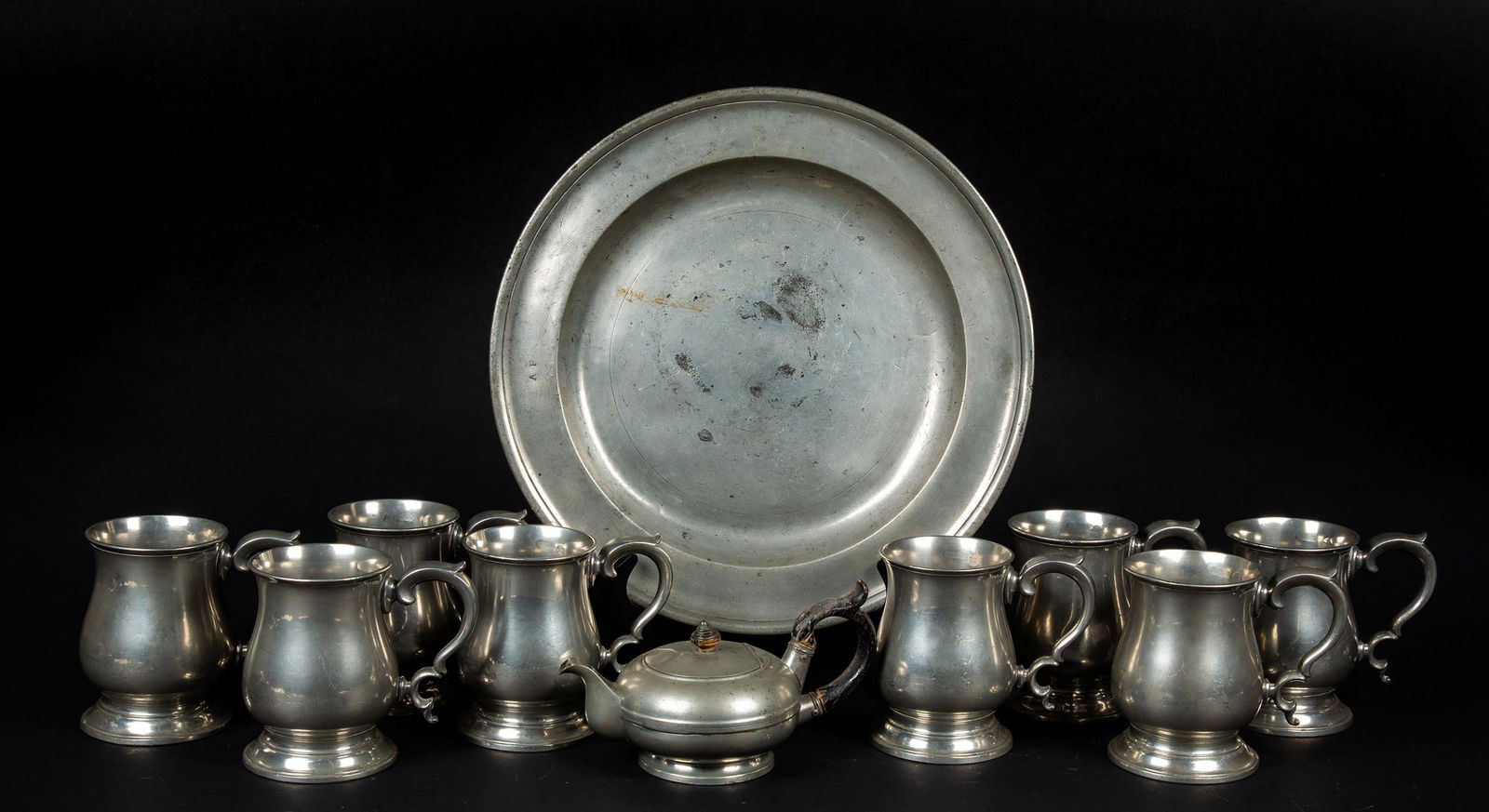 English 19thC Pewter Lot: English 19thC Pewter Lot, A) Set of 8" Sanders and Son, London, pint handled mugs, "VMR 349 LCC" mark on sides, 5" tall. B) 15" diameter pewter charger, London hallmarks on bottom, knife marks. C) "L.