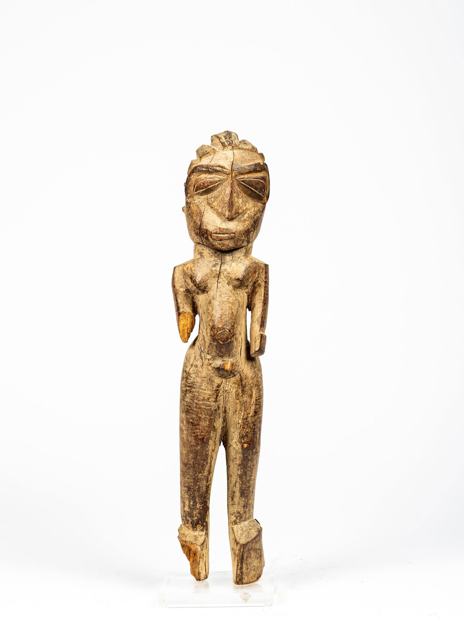 An African Female Figure: An African Female Figure, with encrusted surface, loss to right arm and foot, on lucite base, height: 20 1/4".