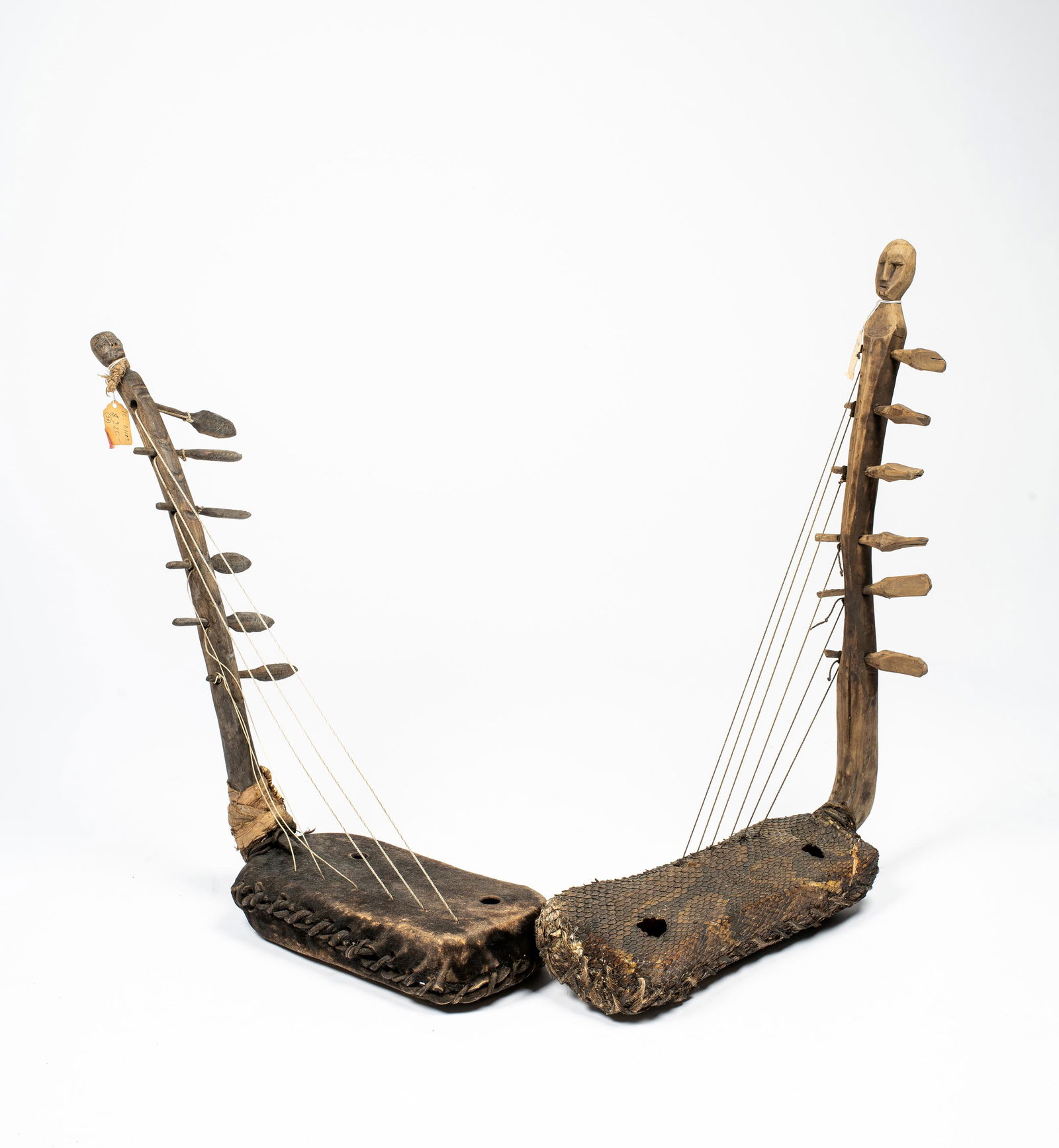 A Pair of Central African Figural Harps: A Pair of Central African Figural Harps, length of longest: 25". Provenance: Acquired in the 1970s by Eva De Ngy Gallery, Provincetown, MA.