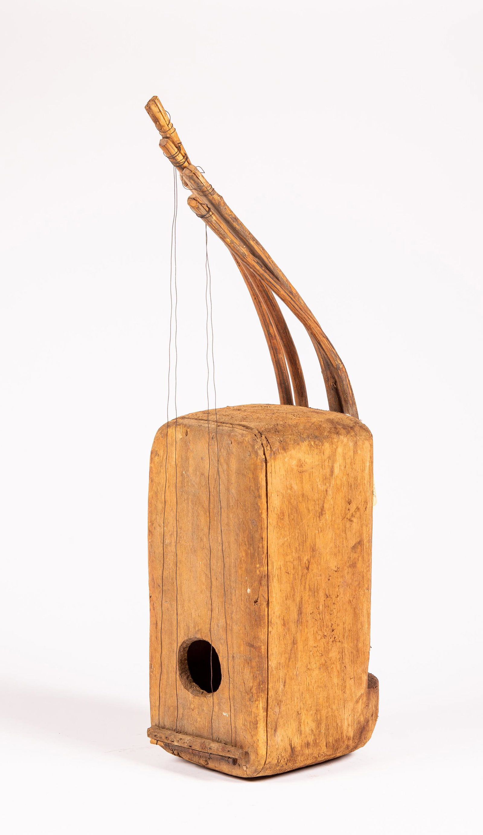 A Central African Harp: A Central African Harp, old dirty surface, appears to have once been five strings but is currently four with bent wood arms attaching to wire which is threaded to a bottom support, old gallery price l