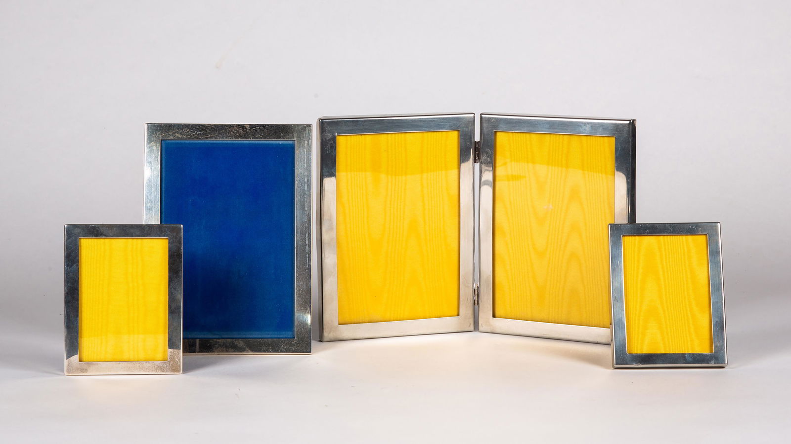 Five Sterling and Pewter Picture Frames, 20thC, Sterling frames 4" x 6" interior and 2 1/2" x 3 1/2": Five Sterling and Pewter Picture Frames, 20thC, Sterling frames 4" x 6" interior and 2 1/2" x 3 1/2" interior, pewter double hinge 4" x 6" interior and 2 1/2" x 3 1/2" interior.