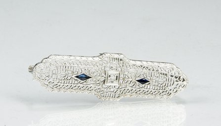 White Gold, Sapphire and Diamond Pin: White Gold, Sapphire and Diamond Pin, marked "10k", Edwardian filigree pin with 2 small marquise sapphires and one small center diamond, 19/20th century.