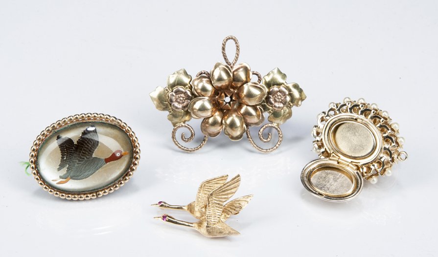 Pins And Pendent: Pins and Pendent: one gold filled floral pin, a gold filled duck pin, an unmarked gold double locket with pearls and an unmarked gold pin of 2 geese in flight with semi precious gem stone eyes. All 20
