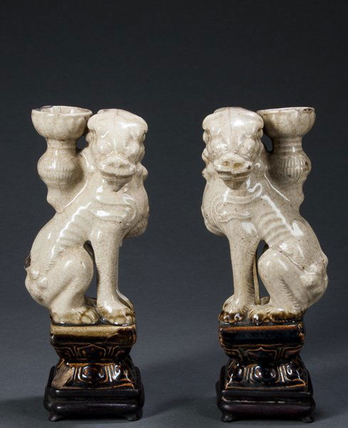 Pair of Chinese Celadon Foo Dog (Joss) Incense Holders: Pair of Chinese Celadon Foo Dog (Joss) Incense Holders, two opposing cream colored figures seated on brown glazed plinths, one chipped, overall crackle surface, hairlines and glaze ware, 9 1/2" tall,