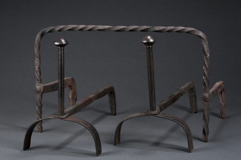 18th/19th Century Wrought Iron Andirons and Roasting: Wrought Iron Andirons and Roasting Rack, the andirons have rounded tops and arched bases, 12" tall, the roasting rack is twisted with log stops and measures 12" tall, 18th/19th Century.