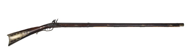 Full Stock Pennsylvania Flint Lock Rifle: Full Stock Pennsylvania Flint Lock Rifle .38 caliber full stock target rifle with double set trigger, This rifles full tiger maple stock is decorated with both pierce-cut and engraved brass butt