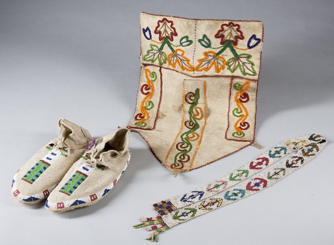 Lot of Three Native American Beaded Items: Lot of Three Native American Beaded Items: A) Pair of moccasins, 8" long. B) Woodlands style beaded pouch with floral designs, 15 1/2" tall with edge loss. C) Loom beaded sash, 30 1/2" long with end l
