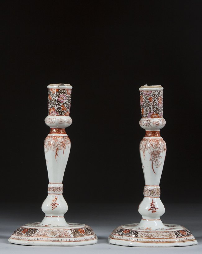 Pair of Chinese Export Candlesticks: Pair of Chinese Export Candlesticks, overall floral pattern, hexagonal base , one with staple repair, 7 1/2" tall, 18th century.