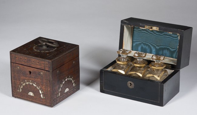 Two European Boxes: Two European Boxes, one oak with brass edges and mother of pearl inlays, a 4" cube and an ebony veneered box with brass inlay, a fitted velvet interior and 3 crystal perfume bottles, 5" wide x 4" tall