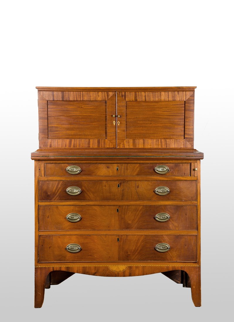 Hepplewhite Mahogany Secretary, made in 2-parts.: Hepplewhite Mahogany Secretary made in 2-parts. The top section has 2 flat panel doors revealing drawers over cubby holes. The bottom section with a fold down writing surface over 4 graduated cock bea