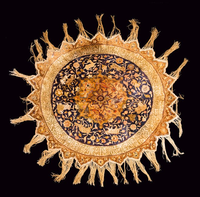 Turkish Round Rug/Table Mat: Turkish Round Rug/Table Mat, silk or polished cotton pile done in the Persian style, central medallion on a blue field surrounded by an Islamic inscription and a zigzag fringed edge, a 20th century co