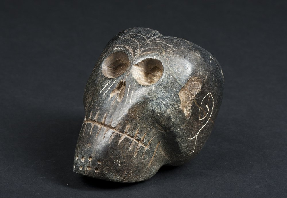 Black Steatite Skull Form Pipe Bowl: Black Steatite Skull Form Pipe Bowl in the style of the Mound-builder culture, particularly Etowah Mound, 4 3/4" tall, large and heavy. Estimate: $300 - $400