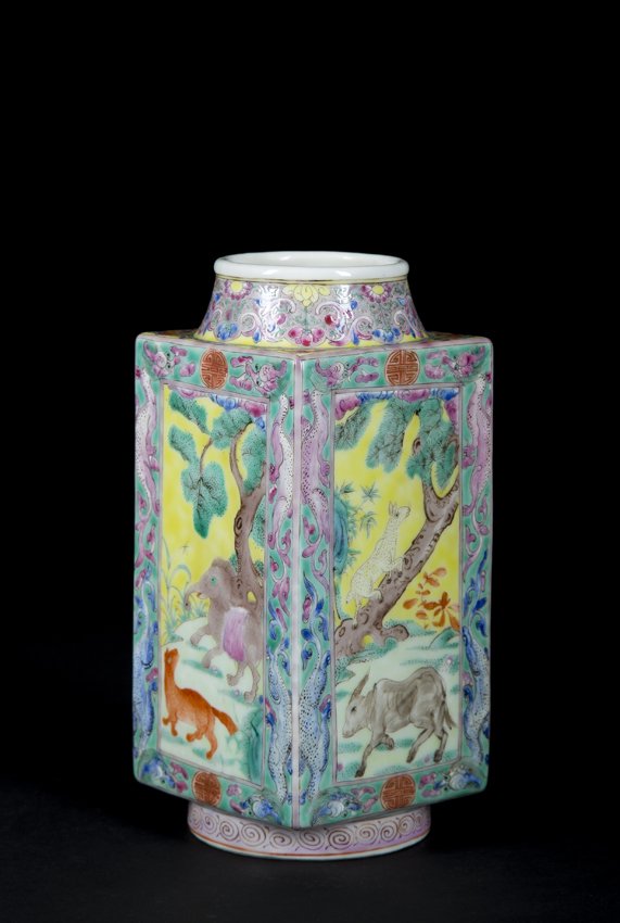 Chinese Famille Rose Vase: Chinese Famille Rose Vase, rectangular body set on a round base and having a tapered neck, paneled scenes on each side of animals on a yellow ground, 7 1/2" tall x 3 1/4" square, 19th century with a Q