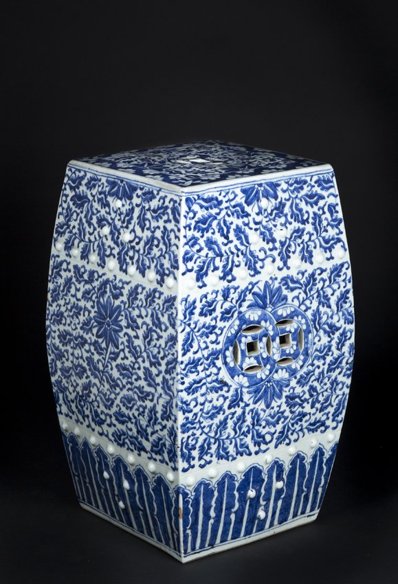 Chinese Porcelain Garden Seat: Chinese Blue and White Porcelain Garden Seat, rectangular bowed middle form with pierced top and sides having two rows of white buttons as horizontal decoration, blue floral decoration on a white grou